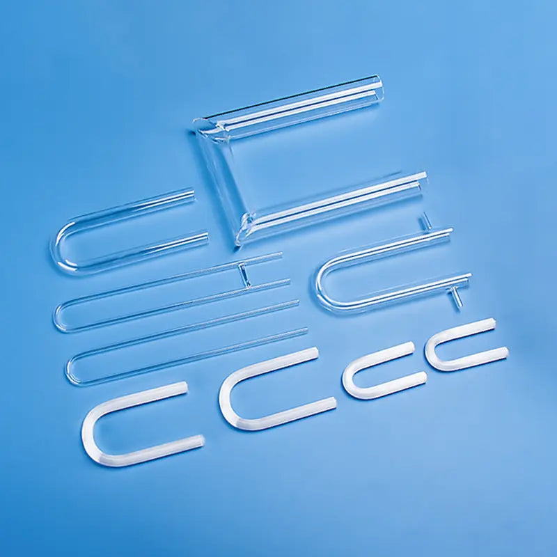 Assortment of custom U-shaped quartz glass tubes in clear and frosted finishes, showcasing various bends and configurations for specialized applications.