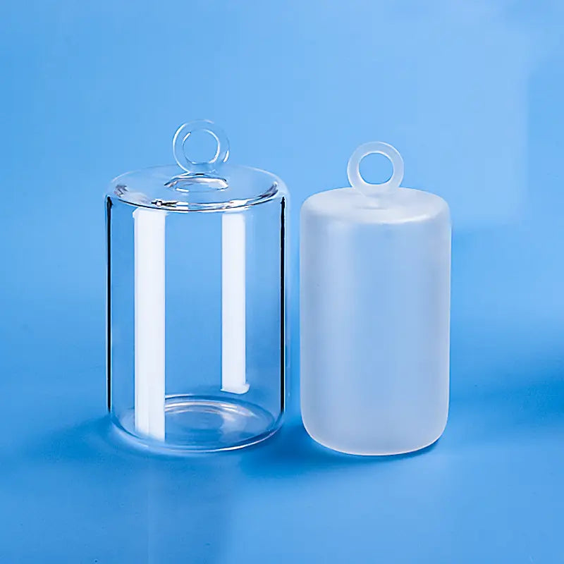 Clear and frosted quartz furnace tube sealing plugs with top ring handles, for laboratory use.