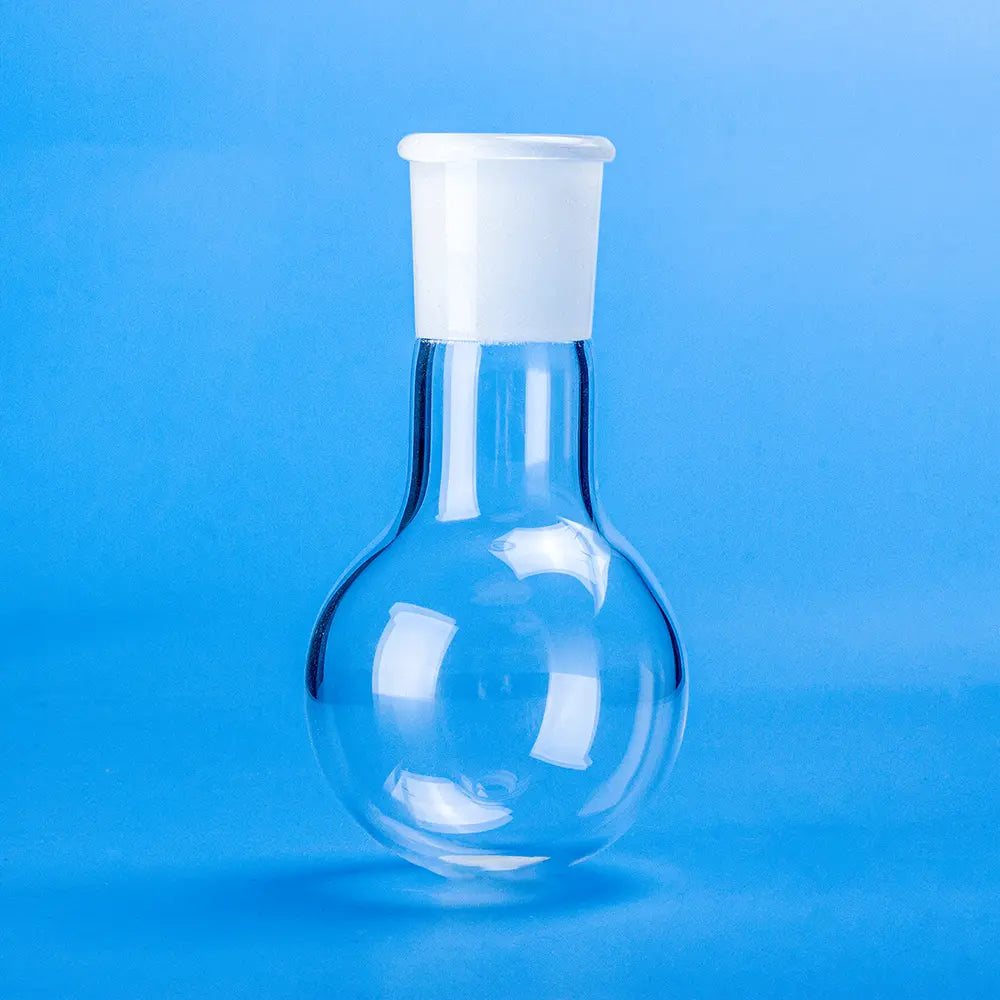 Clear quartz single-neck boiling flask with a frosted ground joint on a blue background.