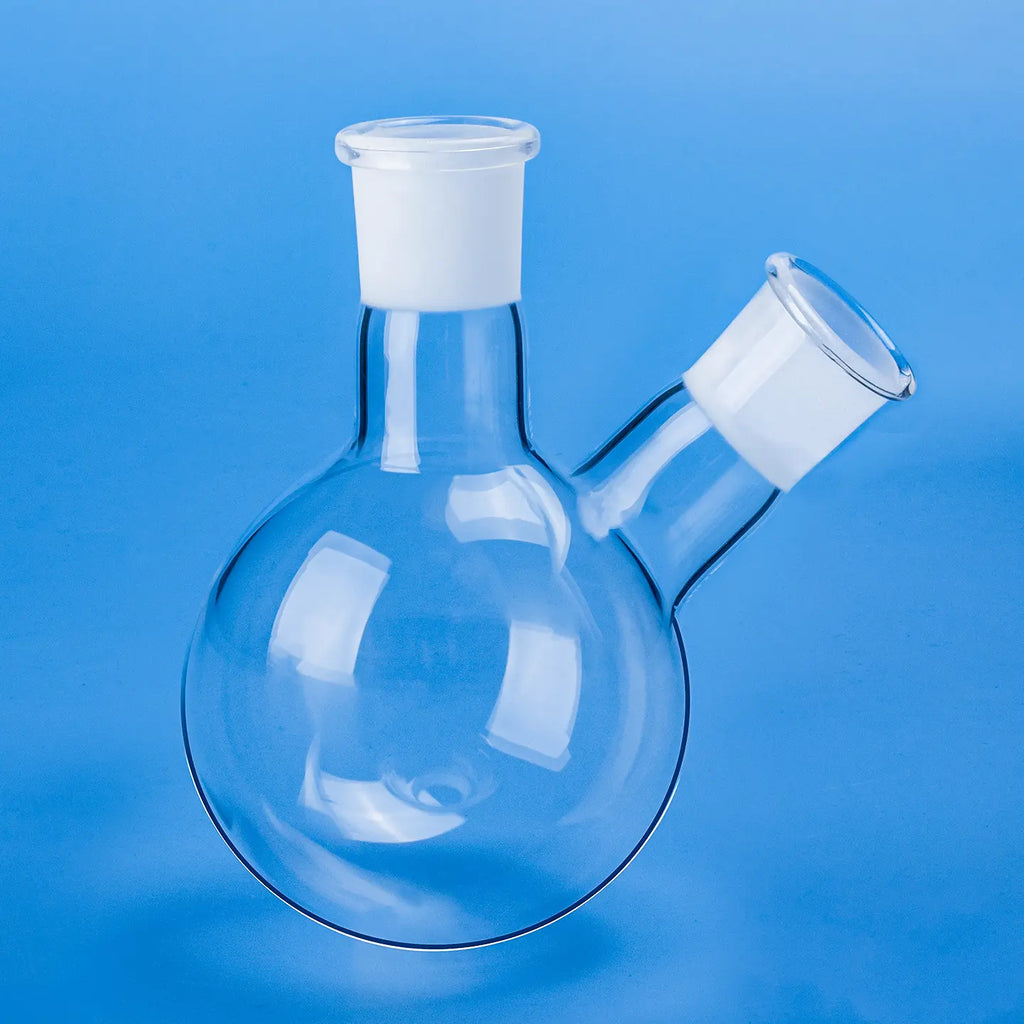 Clear quartz two-neck round-bottom flask with frosted ground joints, showcasing its design on a blue background.