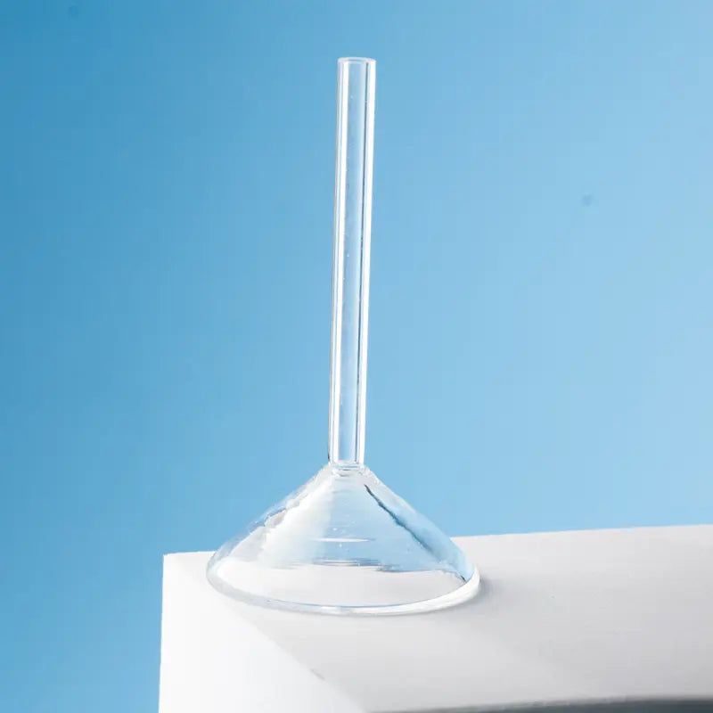 Close-up of the upper part of a clear quartz glass funnel with a straight stem