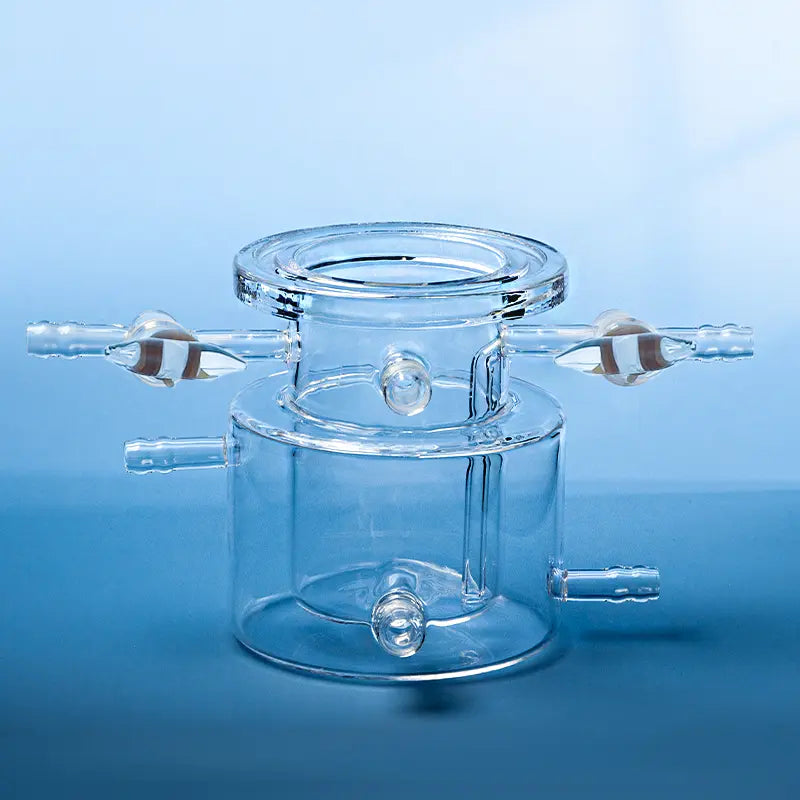 Front view of a transparent quartz photocatalytic reactor, highlighting the central chamber and side tubes.
