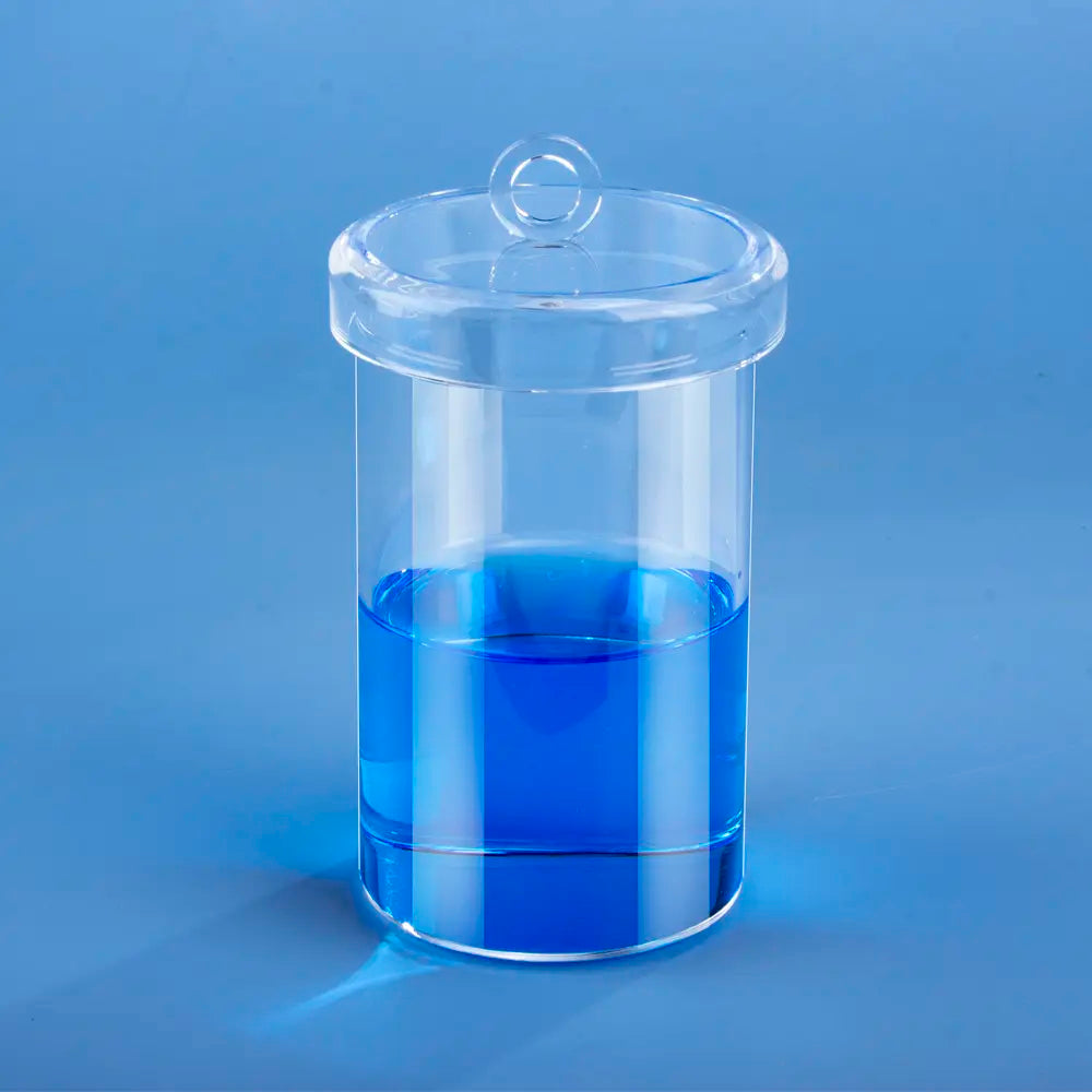 Transparent quartz straight-wall crucible with a lid, containing blue liquid, designed for laboratory and high-temperature applications