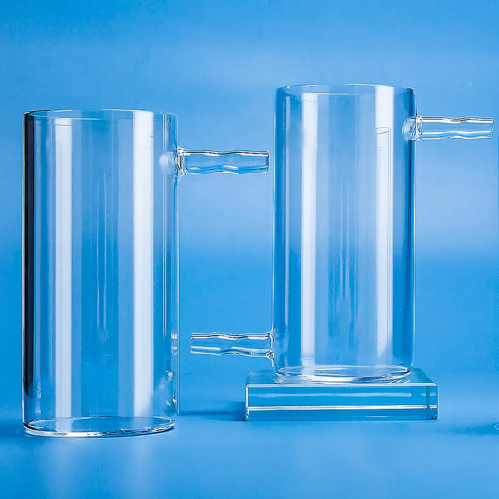 Two clear quartz cylindrical beakers with side arms, one with a lower side arm and the other with an upper side arm, displayed on a blue background.