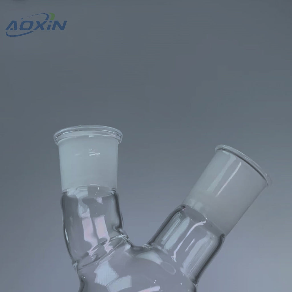 High purity quartz two-neck round-bottom flask with ground joints, showcasing its design for high temperature and chemical resistance