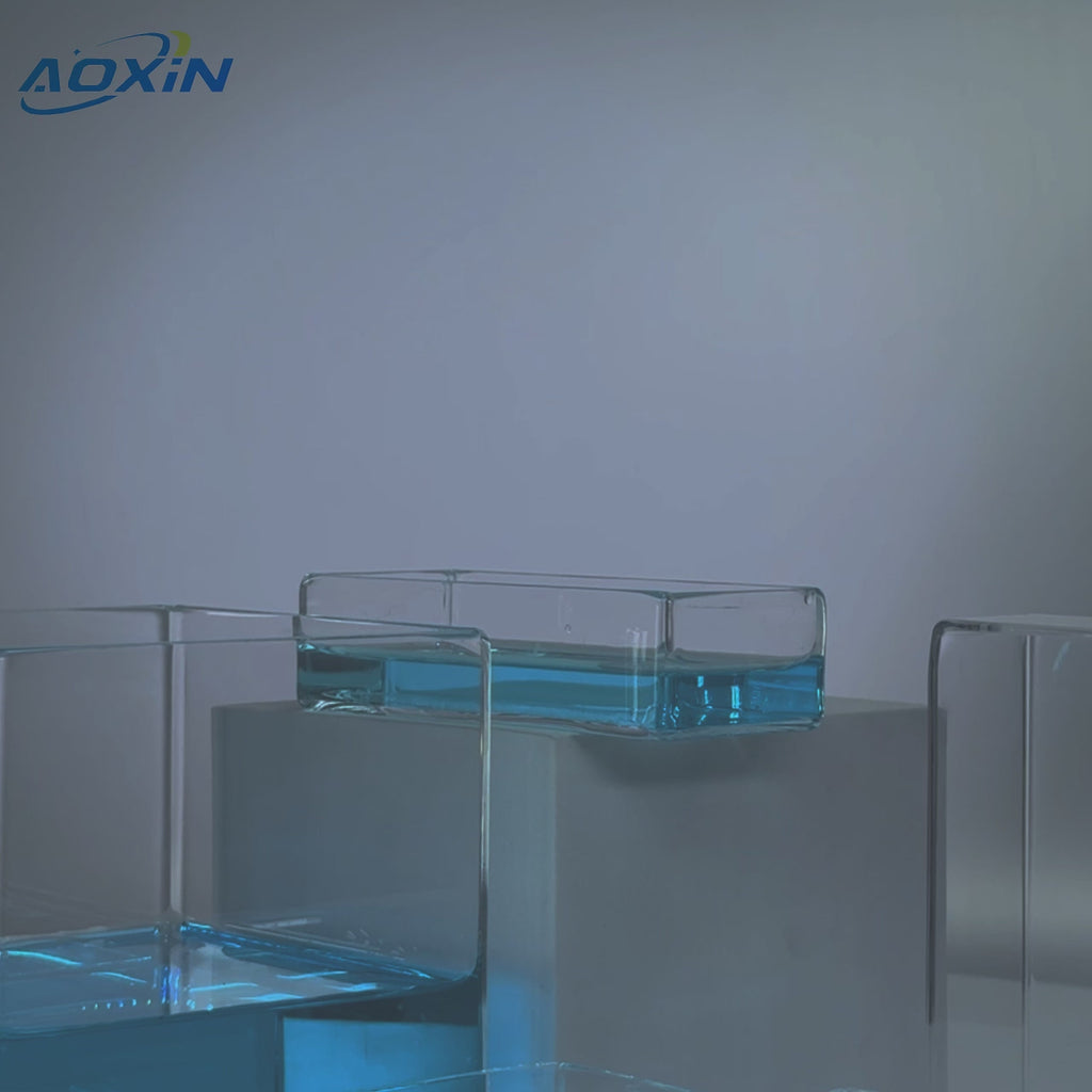 High Purity Quartz Glass Square Tanks and Containers - Custom Fabricated, showcasing various sizes of clear square tanks, some filled with blue liquid