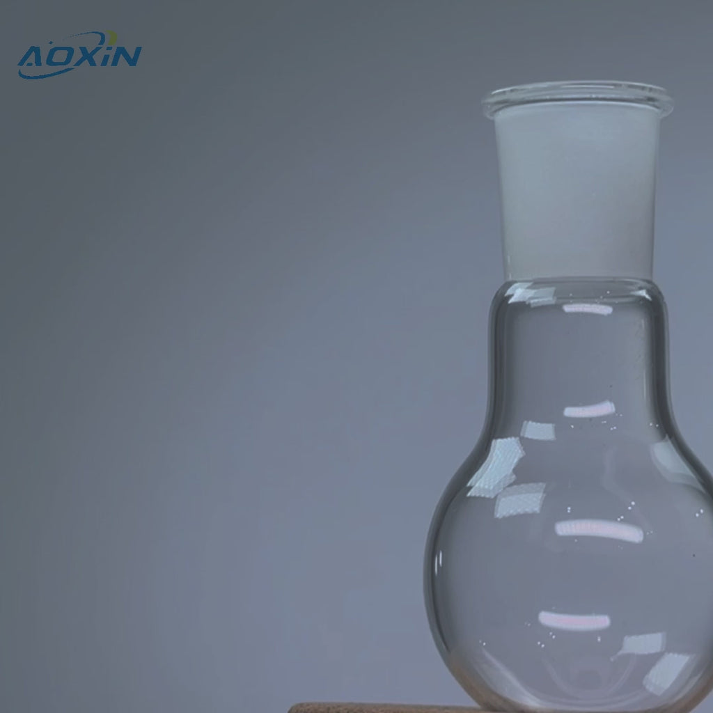 Close-up of a high purity quartz single-neck round bottom boiling flask, highlighting its clear glass construction