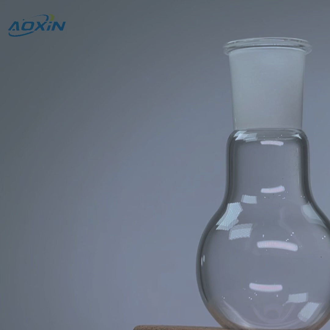 Close-up of a high purity quartz single-neck round bottom boiling flask, highlighting its clear glass construction
